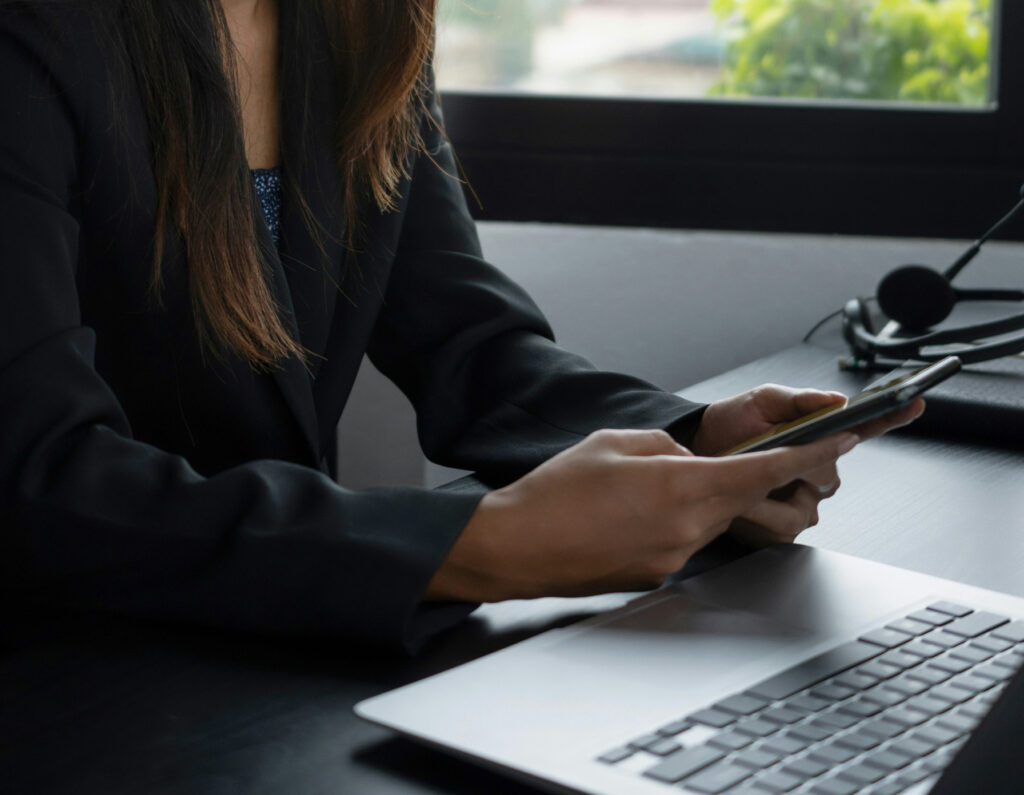 A businesswoman using a digital business card on a smartphone