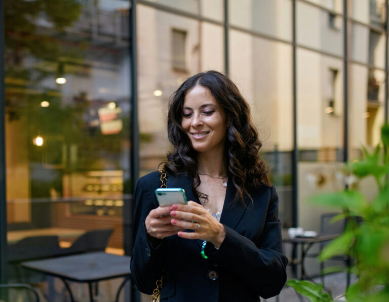 A businesswoman using an iPhone